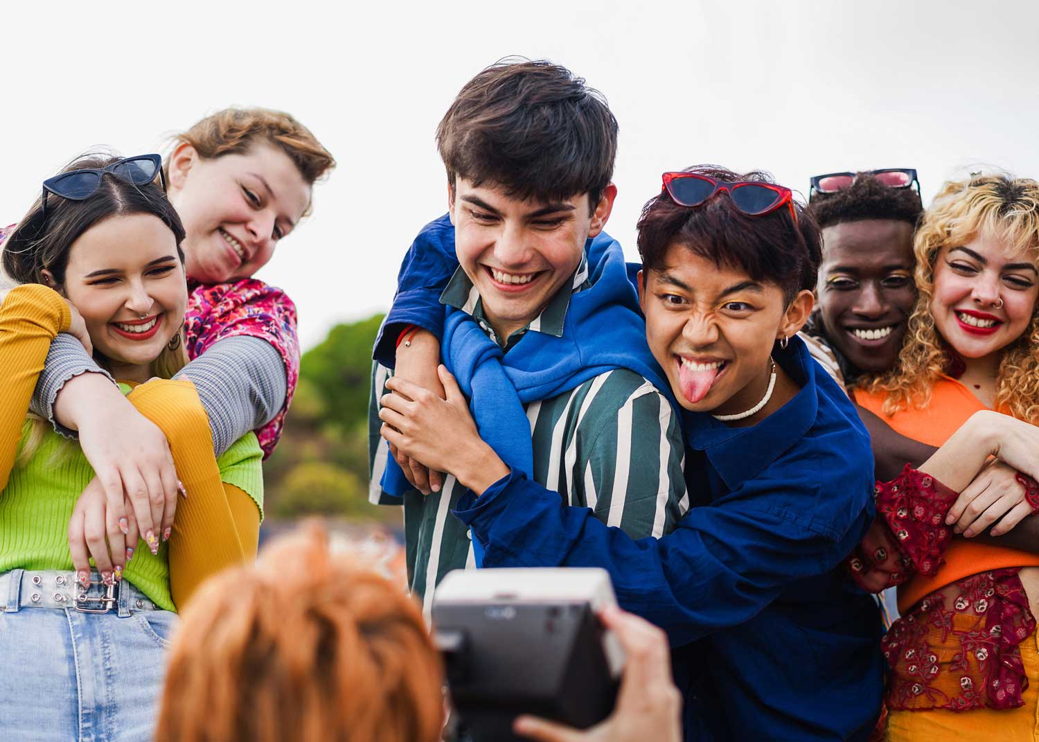 A group of young people, Gen Z, hanging out and having fun together.